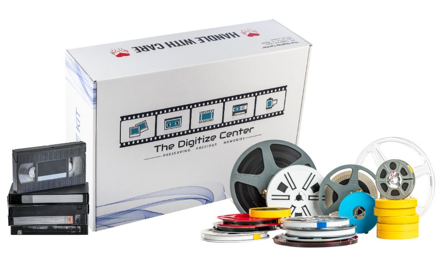 The Digitize Center’s Digitize Kit box surrounded by VHS tapes, film reels, and audio reels